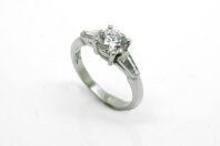 0.70ct Round Brilliant Cut Diamond Engagement Ring with 0.10ct Baguette Diamonds in Platinum